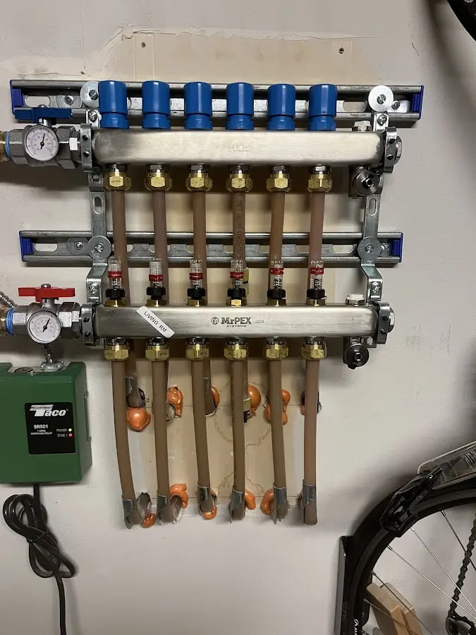 Plumber performing Water Heater Repair at a residential property in Youngsville